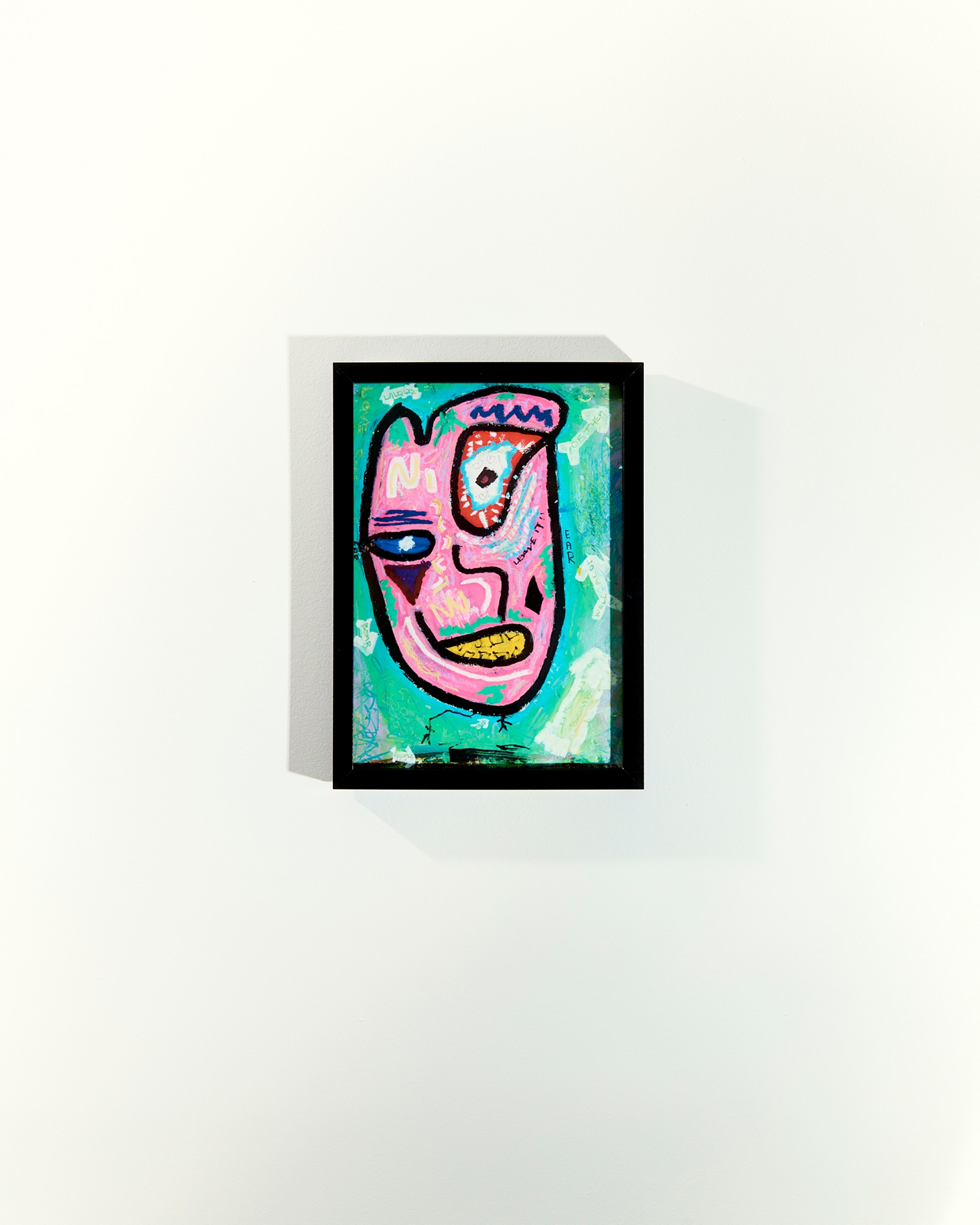 Framed neo-expressionist face painting in pink and teal on white gallery wall, mixed media by Matthew Krueger