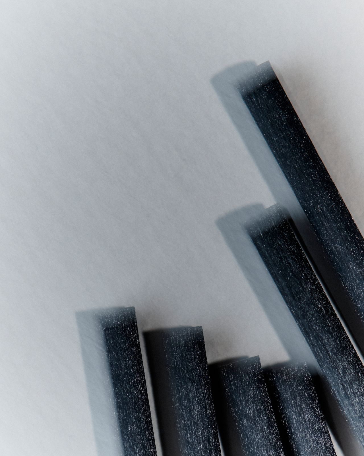 Overhead close-up of Fig Tree reed diffuser showing golden oil surface and black reeds